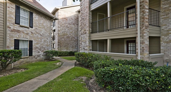 Picture of a condo building courtyard.