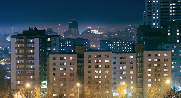 Picture of city buildings at night.