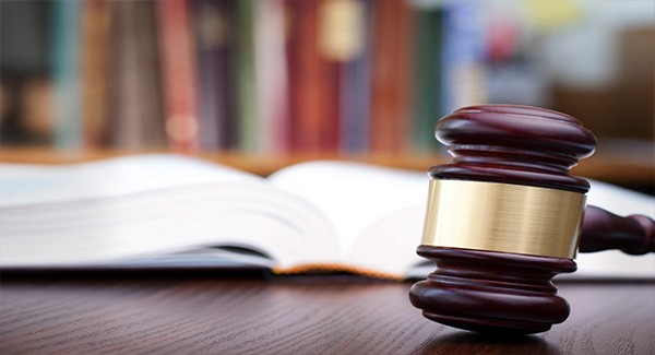 Picture of a gavel and a law book.