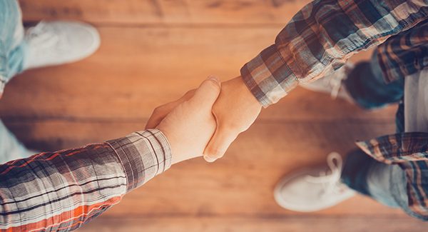 Picture of two people shaking hands.