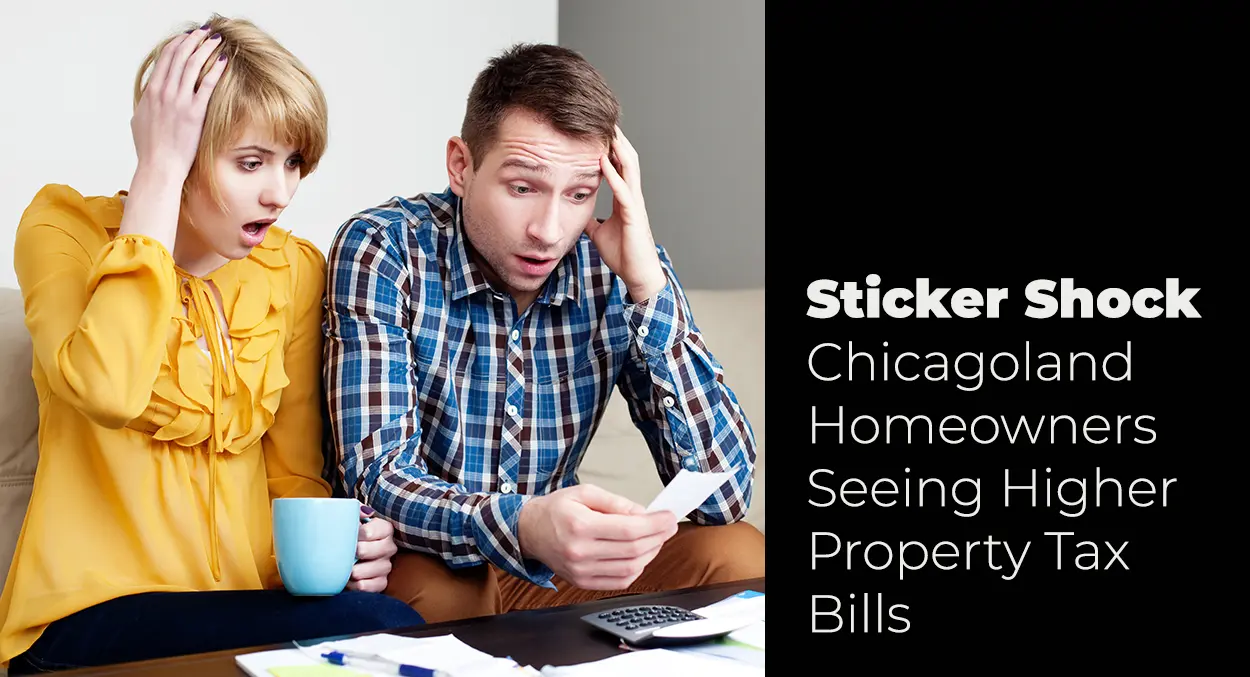 A man and woman look surprised and worried while examining a bill at a table, with text about rising property tax bills for Chicagoland homeowners.