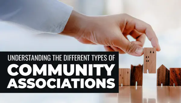 A hand arranges small wooden blocks shaped like buildings, with text overlay: "Understanding the different types of community associations.