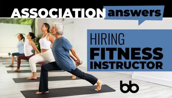 Four women in athletic wear practice yoga indoors, with text on the image reading “ASSOCIATION answers—Hiring Fitness Instructor.”.