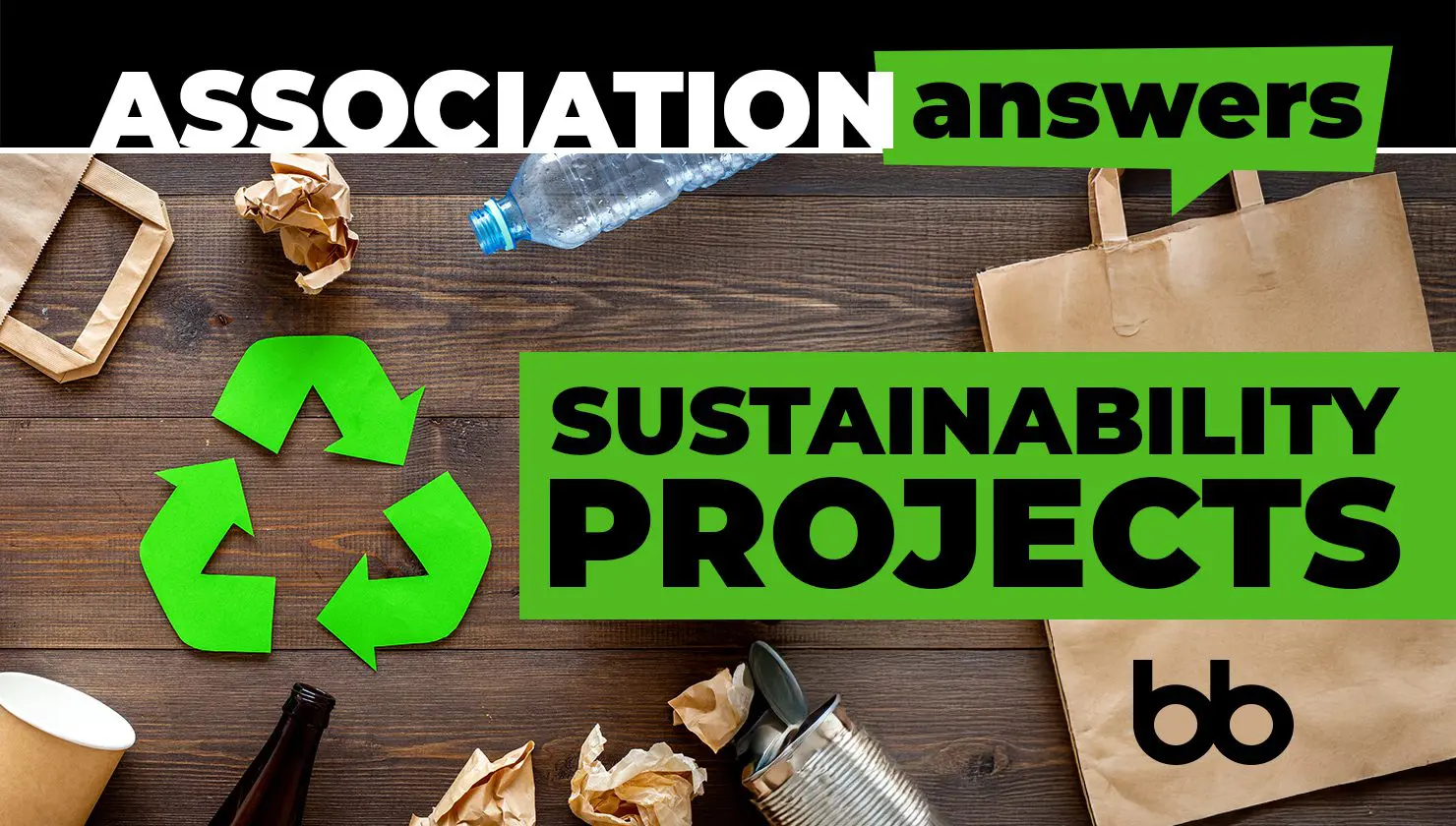 Top view of recyclables like paper, plastic, and glass on a wooden table with green recycle arrows and bold text reading "Association Answers: Sustainability Projects.