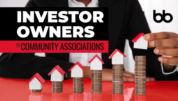 A person stacks small model houses on ascending piles of coins with the text "Investor Owners in Community Associations" displayed beside them.