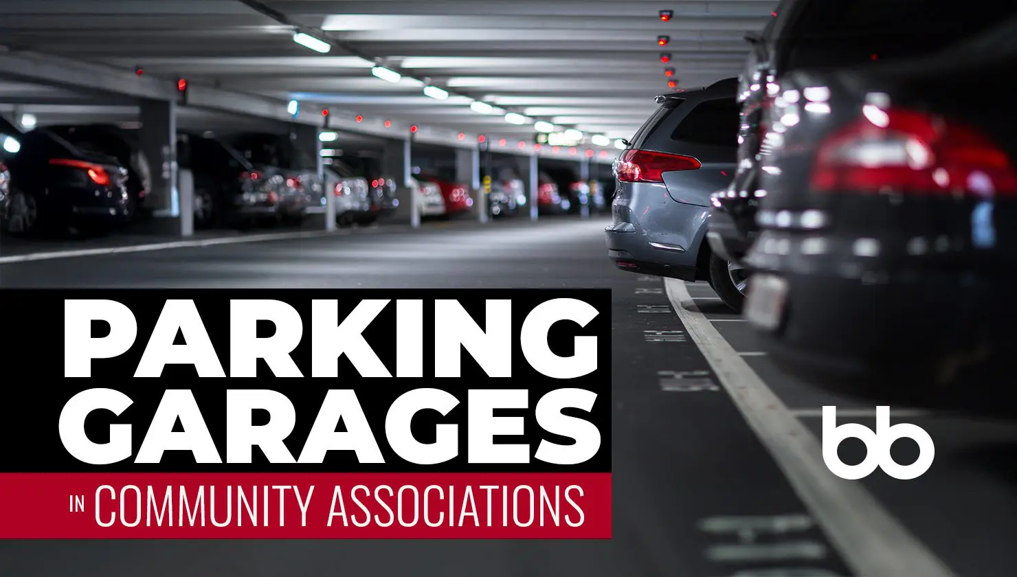 Rows of cars parked in a multi-level parking garage, with overhead lights and a sign reading "Parking Garages in Community Associations" in bold text.