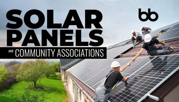Three workers in hard hats install solar panels on a sloped roof, with trees and grass visible beside the building. Text reads, "Solar Panels and Community Associations.